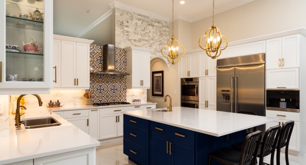 A beautiful shot of a renovated kitchen with a brand new island.