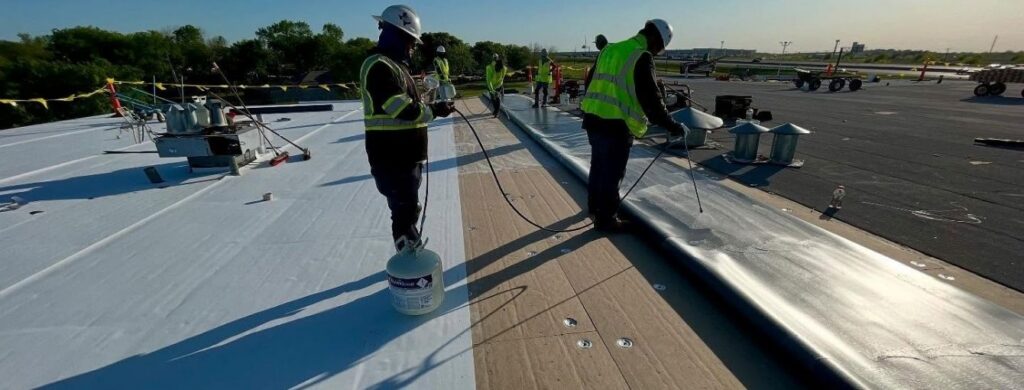 A commercial roof that workers are working on. 